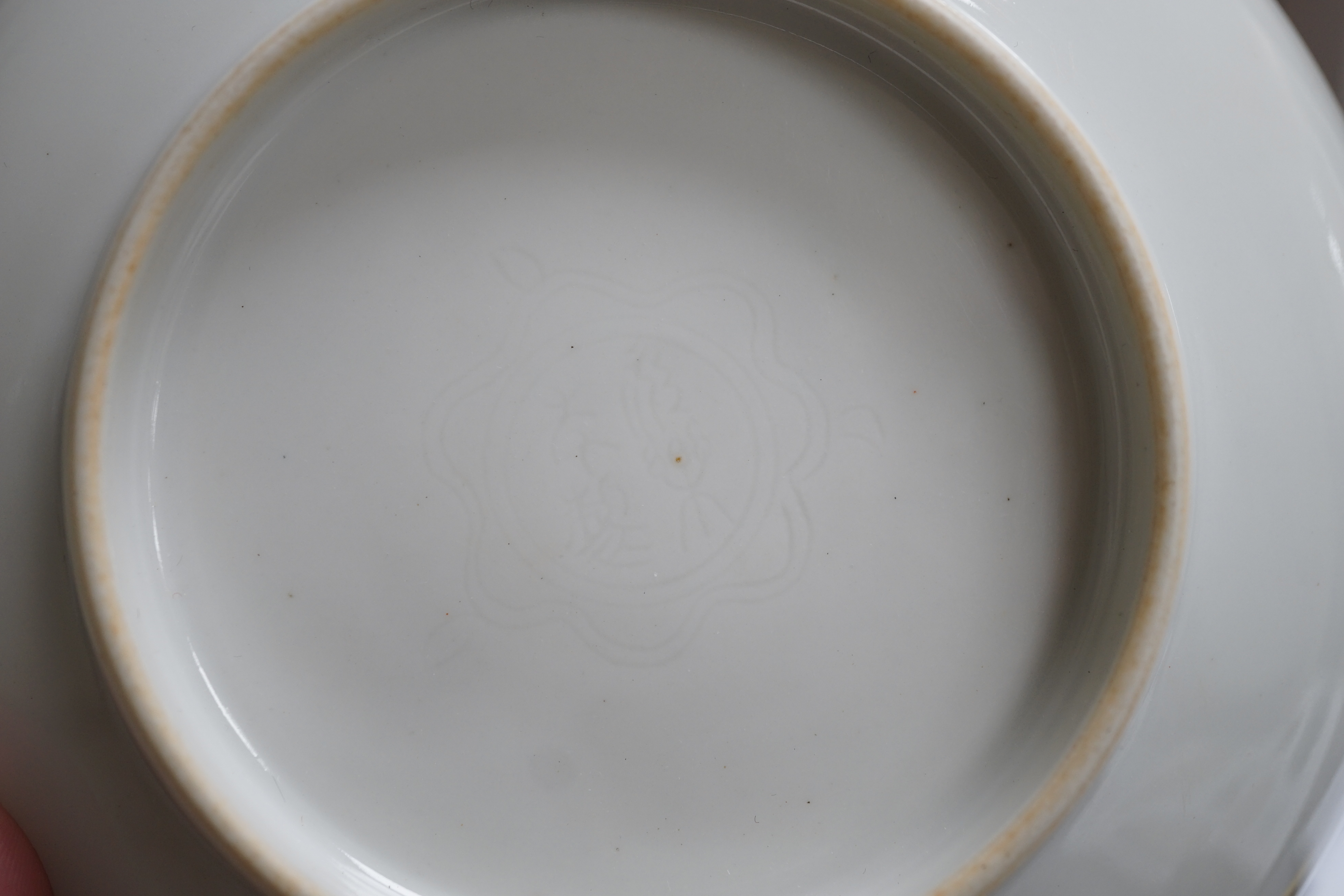 A Chinese moulded white glazed saucer dish, Yongle mark, Republic period